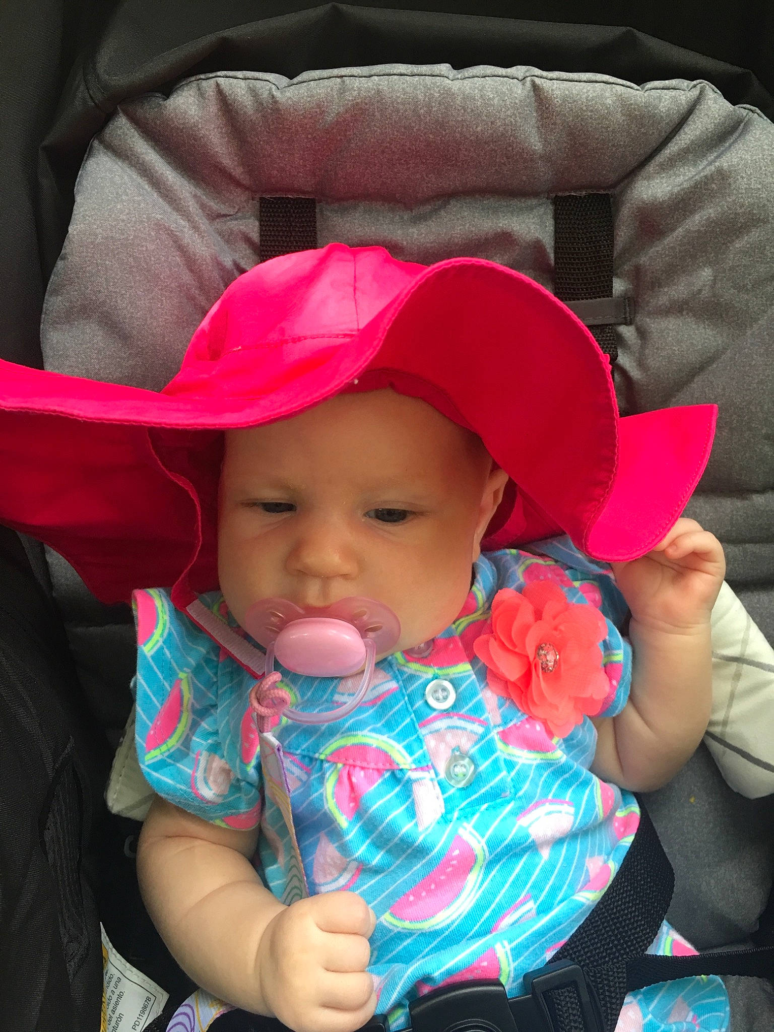 Hailee joined the competition — help win amazing prizes! baby, baby_products, bonnet, car_seat, cheek, child, fashion_accessory, hat, headgear, headwear, person, pink, product, skin, sun_hat, toddler