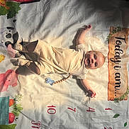 Baylor joined the competition — help win amazing prizes! baby, barn, child, cow, cream_outfit, farm_animals, floor, happy, infant, light_shadow, lying_down, milestone_blanket, months, numbers, pig, portrait, smiling, star_marker, toy, vegetables