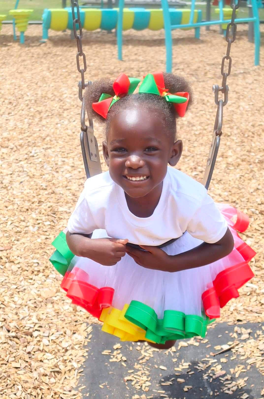 Shay joined the competition — help win amazing prizes! adaptation, baby_toddler_clothing, child, city, event, face, facial_expression, fun, grass, happy, joy, leisure, people_in_nature, person, play, playground, recreation, smile, soil, swing