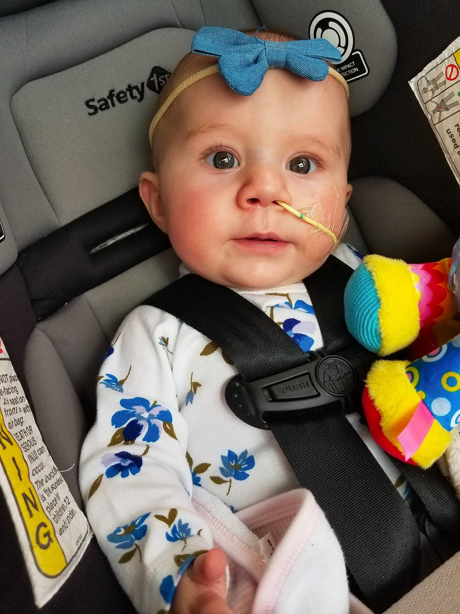 Teagen is registered to the contest to win money with this photo: auto_part, baby, baby_in_car_seat, baby_products, baby_toddler_clothing, car_seat, cheek, child, ear, hair_accessory, head, headgear, headwear, person, product, seat_belt, toddler, toy