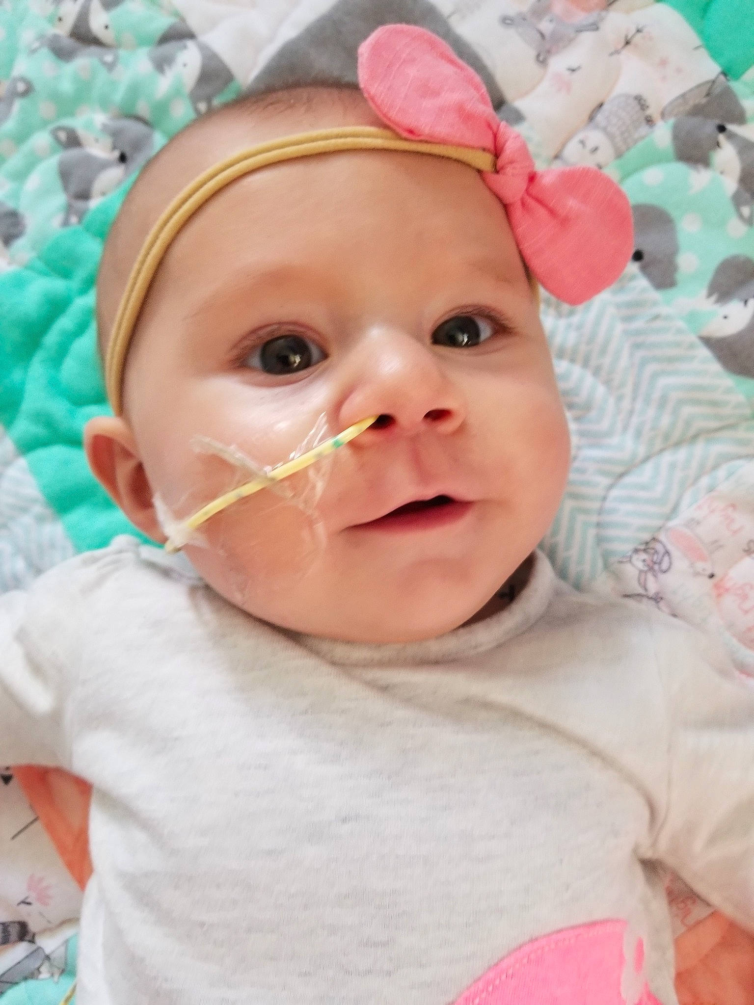 Teagen is registered to the contest to win money with this photo: baby, baby_making_funny_faces, cheek, child, face, facial_expression, head, headgear, headwear, lip, nose, person, pink, skin, smile, toddler