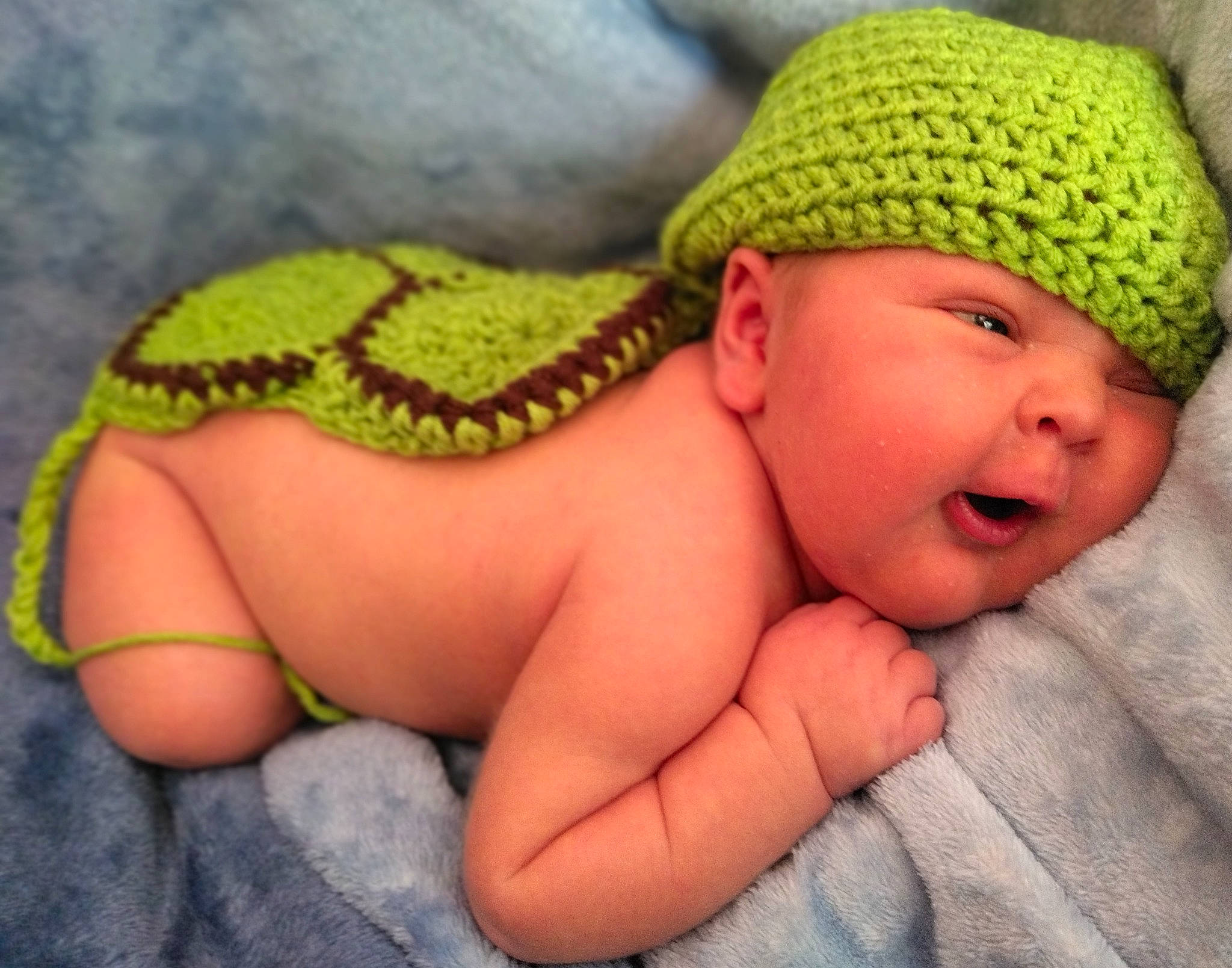 Robert is registered to the contest to win money with this photo: baby, baby_toddler_clothing, cap, cheek, close_up, eye, finger, fun, grass, hand, happy, headwear, iris, knit_cap, linens, mouth, nail, person, skin, thumb