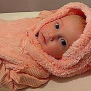 Madison joined the competition — help win amazing prizes! baby, bed, blanket, child, clothing, cozy, cute, eyes, face, fist, fluffy, hand, hoodie, indoor, infant, pink, portrait, sleeping_area, soft, young