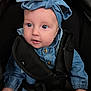 apparel, baby, blue_eyes, button, car_seat, child, child_seat, clothing, cute, denim, fabric, face, hand, headband, infant, portrait, seatbelt, security, sitting, young_child