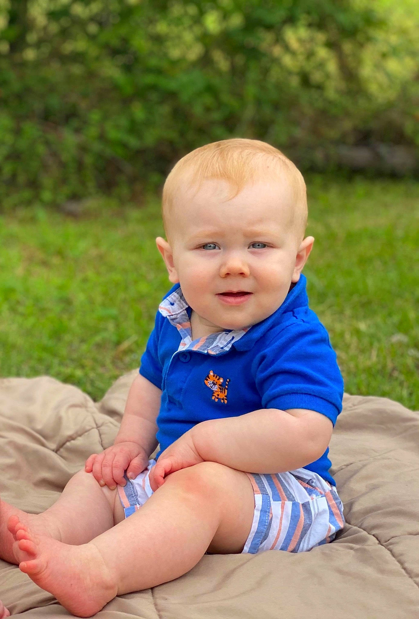 Kaeden joined the competition — help win amazing prizes! baby, blue, child, eye, face, family, grass, head, people, person, photography, plant, sitting, skin, smile, summer, toddler, vacation