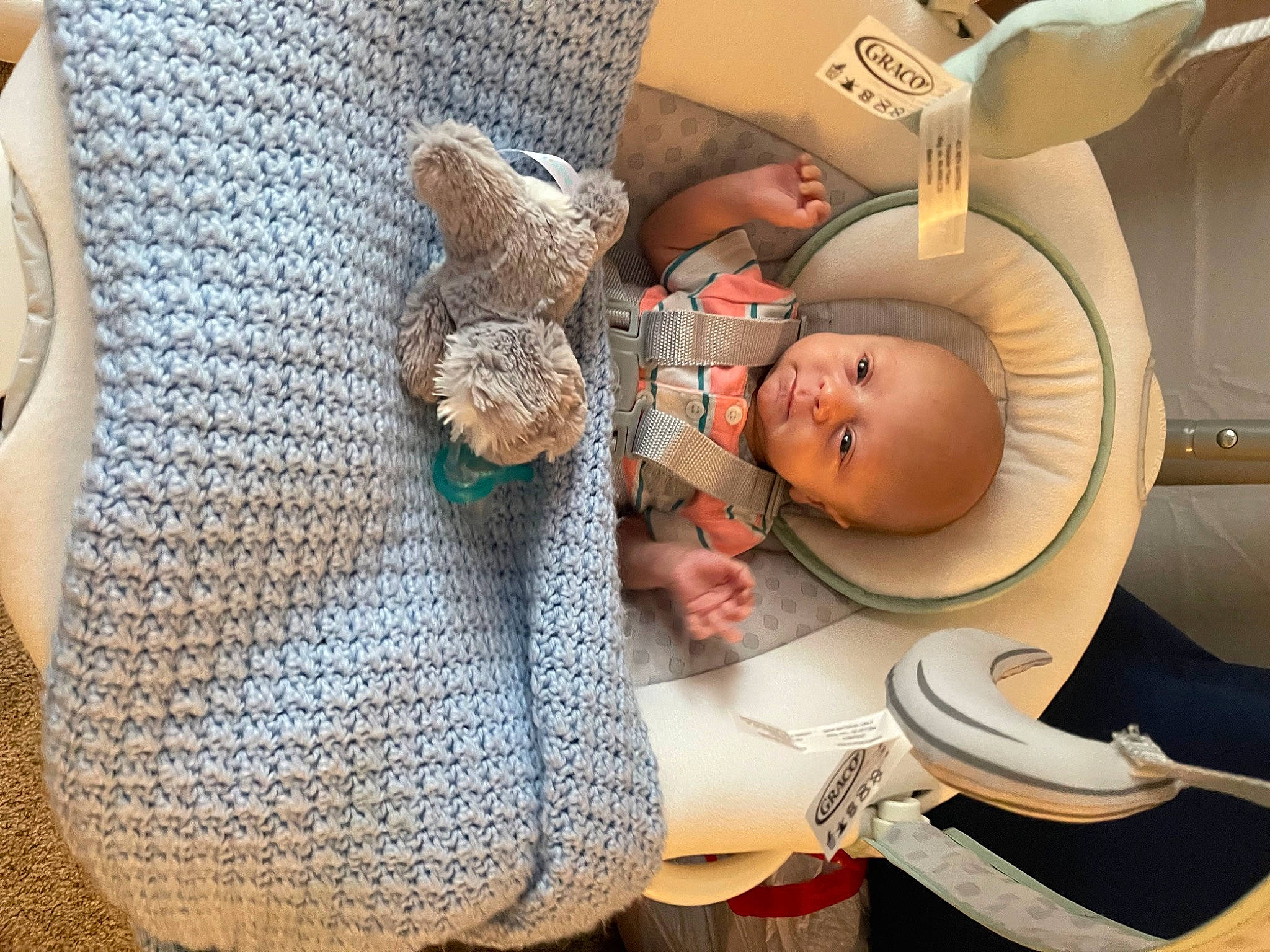 Cyrus is registered to the contest to win money with this photo: arm, baby, baby_products, baby_safety, baby_sleeping, baby_toddler_clothing, child, comfort, finger, hat, headgear, linens, pattern, person, room, skin, sleeve, smile, textile, toddler