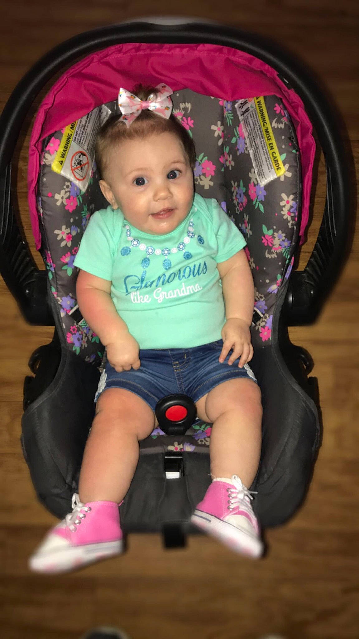 Frankie is registered to the contest to win money with this photo: baby, baby_carriage, baby_products, car_seat, cheek, child, person, pink, play, product, sitting, toddler