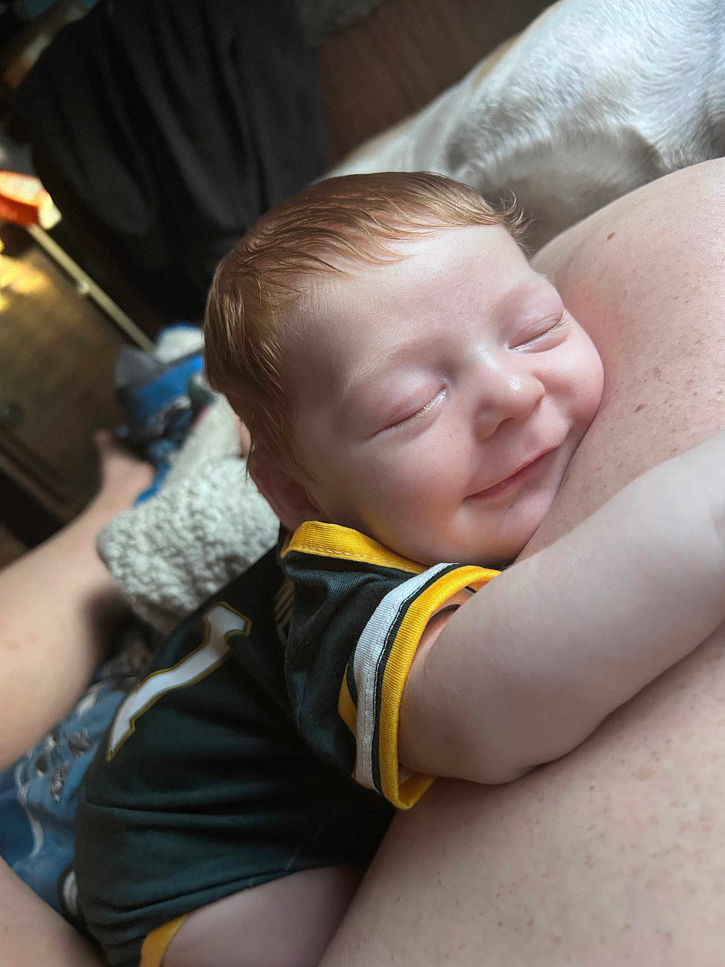 Daniel is registered to the contest to win money with this photo: baby, smile, sleeping, closeup, face, arm, skin, cuddle, child, infant, person, clothing, indoor, happy, comfort, rest, human, head, young, relax