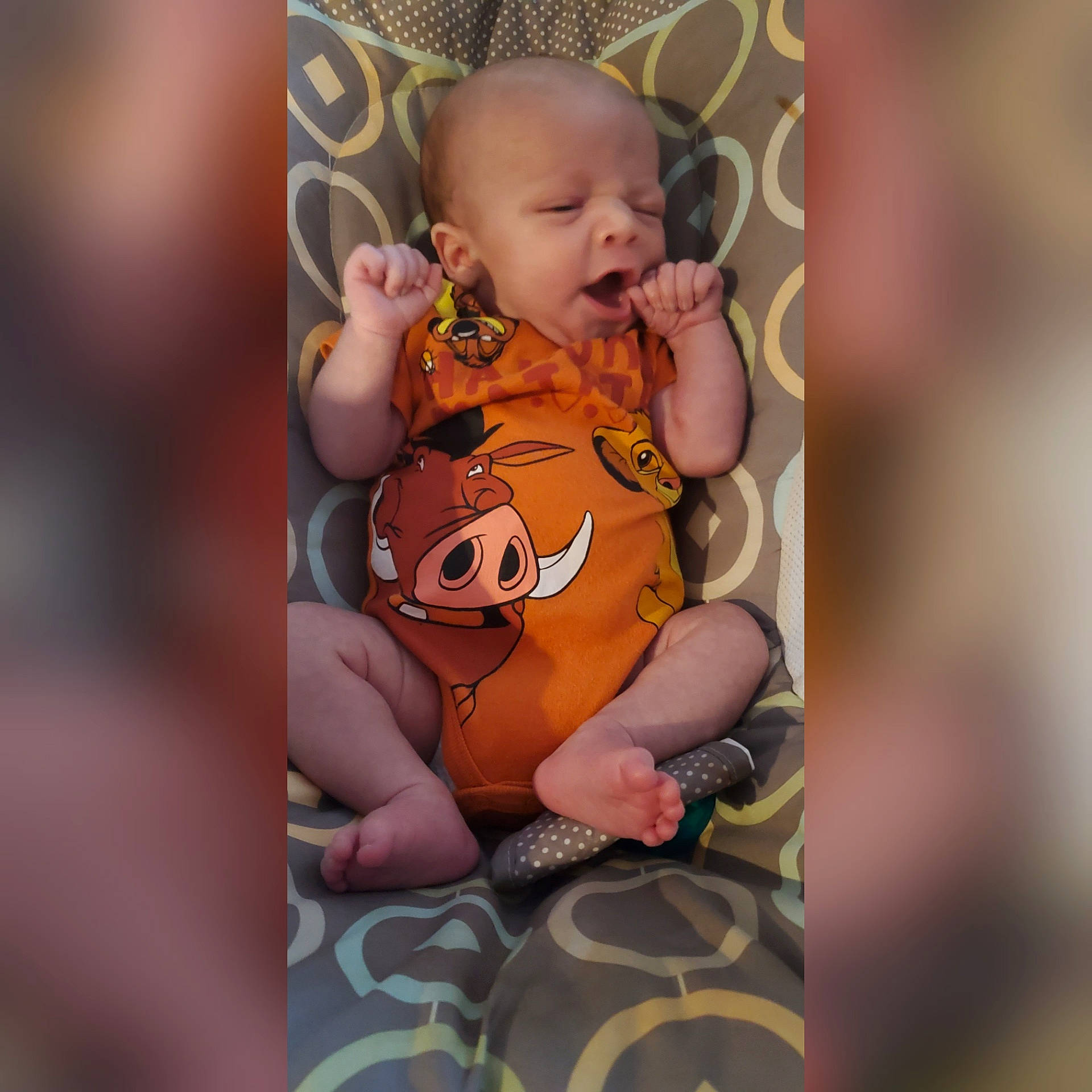 Jeremy is registered to the contest to win money with this photo: art, baby, baby_toddler_clothing, brown, cheek, child, eye, happy, nail, pattern, peach, person, pink, sitting, skin, sleeve, thumb, toddler