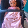 Daïanna participe au concours pour gagner de l'argent avec cette photo : baby, child, stroller, blanket, pink, headband, bow, indoors, cute, infant, clothing, person, face, seat, comfort, soft, floor, expression, portrait, young
