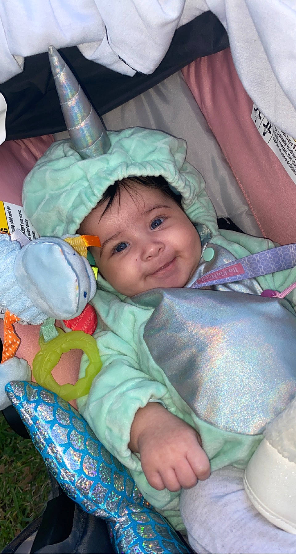 Kaycee is registered to the contest to win money with this photo: baby, baby_carriage, baby_products, baby_toddler_clothing, cheek, child, comfort, eye, grass, happy, head, headwear, iris, joy, lap, linens, person, product, sitting, skin