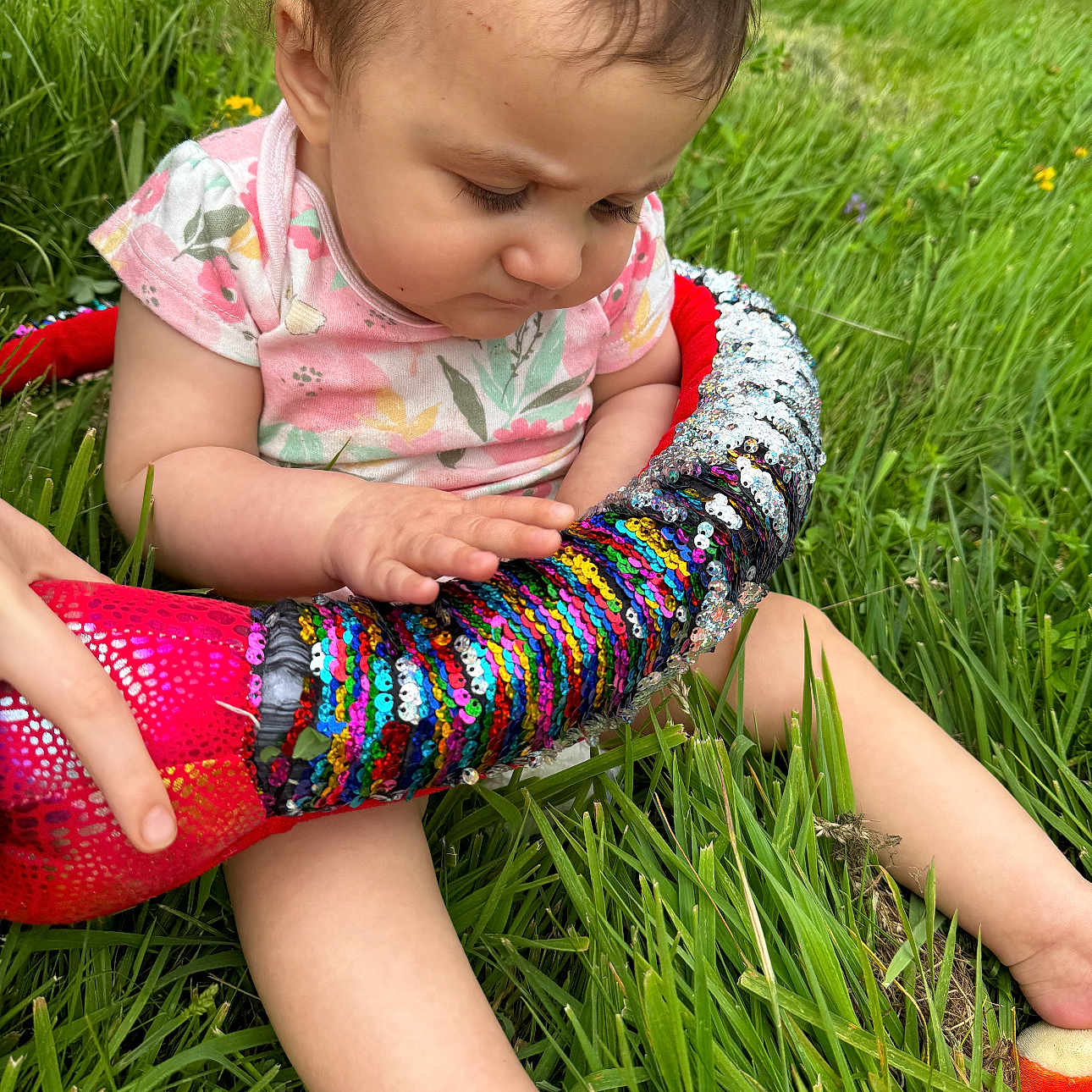 Trinity is registered to the contest to win money with this photo: accessories, baby, bangles, bodypart, bracelet, clothing, face, finger, grass, hand, head, hosiery, jewelry, lawn, ornament, person, photography, plant, portrait, sock