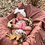 Wrenlee joined the competition — help win amazing prizes! newborn, baby, sleeping, headband, bow, blanket, autumn, leaves, outdoor, portrait, cozy, infant, nature, soft, cute, resting, fall, child, skin, peaceful