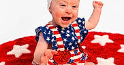 Wrenlee joined the competition — help win amazing prizes! american_flag, baby, blue, bow, child, clothing, cute, footwear, happy, headband, infant, pattern, playful, red, rug, shoe, sitting, smile, stars, white