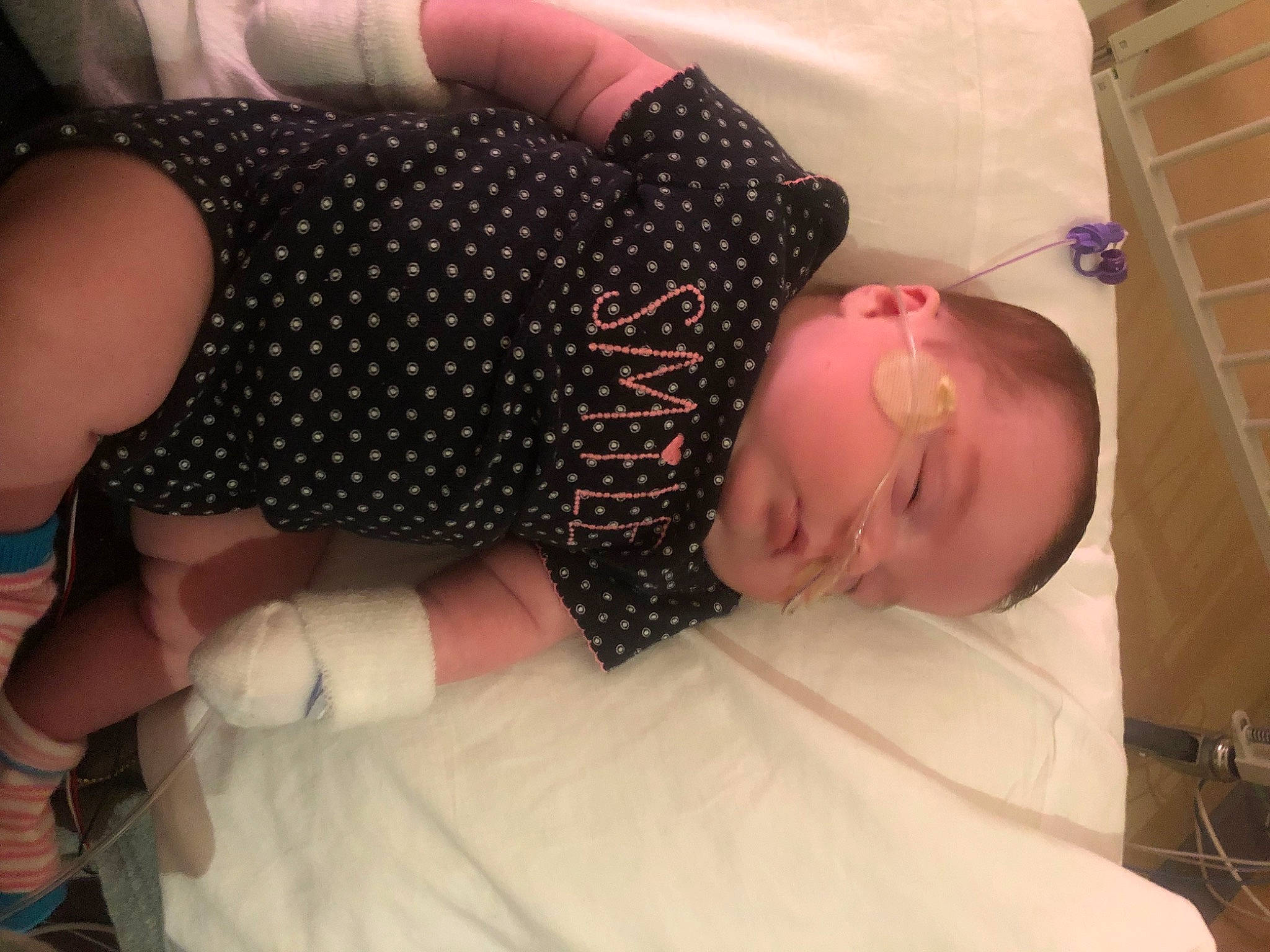 Maralee is registered to the contest to win money with this photo: abdomen, baby, baby_safety, baby_sleeping, baby_toddler_clothing, bed, chest, child, comfort, elbow, flooring, human_leg, joint, knee, linens, mouth, pattern, person, textile, thigh