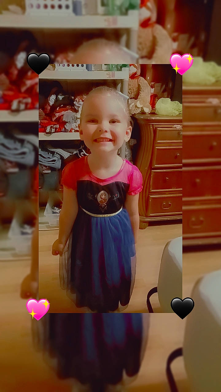 Isabella is registered to the contest to win money with this photo: baby_toddler_clothing, cabinetry, chair, dress, event, facial_expression, fun, hair, hairstyle, happy, joint, joy, person, pink, product, purple, skin, sleeve, smile, standing