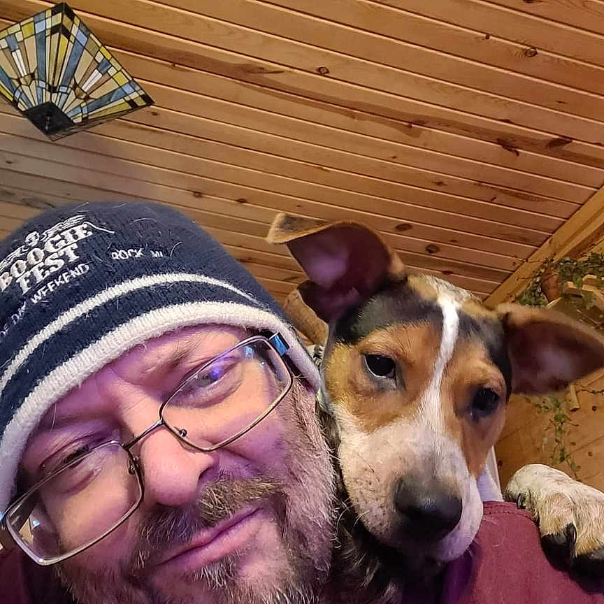 Dallas is registered to the contest to win money with this photo: accessories, adult, animal, canine, cap, clothing, dog, face, glasses, hat, head, hound, indoors, interiordesign, male, person, pet, photography, portrait, puppy