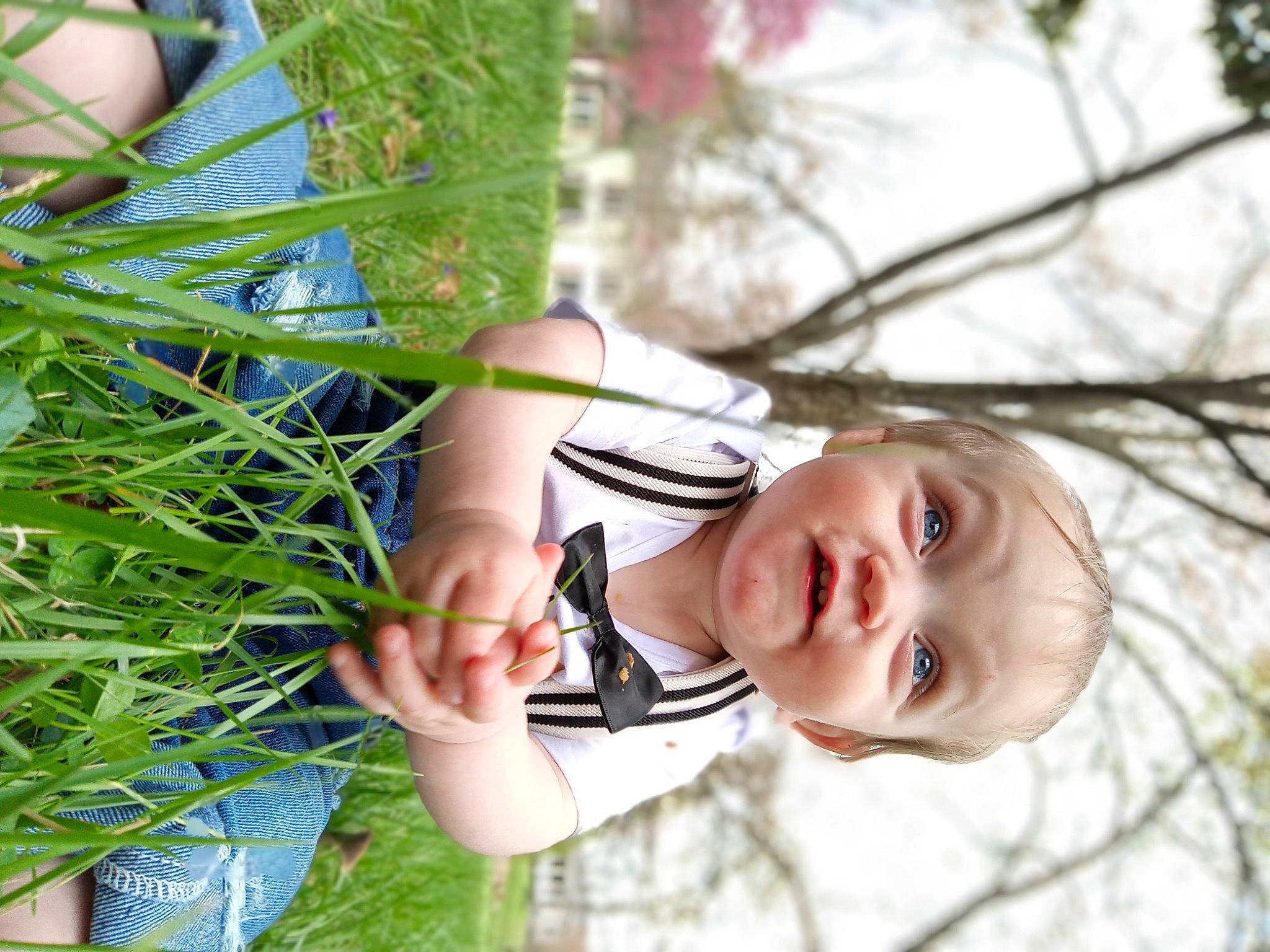 Emery is registered to the contest to win money with this photo: baby, baby_toddler_clothing, child, dress, glasses, grass, grass_family, happy, leisure, lip, pattern, people_in_nature, person, plant, smile, sunglasses, toddler, tree, twig, window