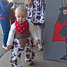 bandana, boy, brick_wall, cardboard_prop, child, children, concrete, costume, cow_print, cowboy_costume, girl, group, outdoor, playtime, portrait, red_bandana, sidewalk, sneakers, toddler, white_tights