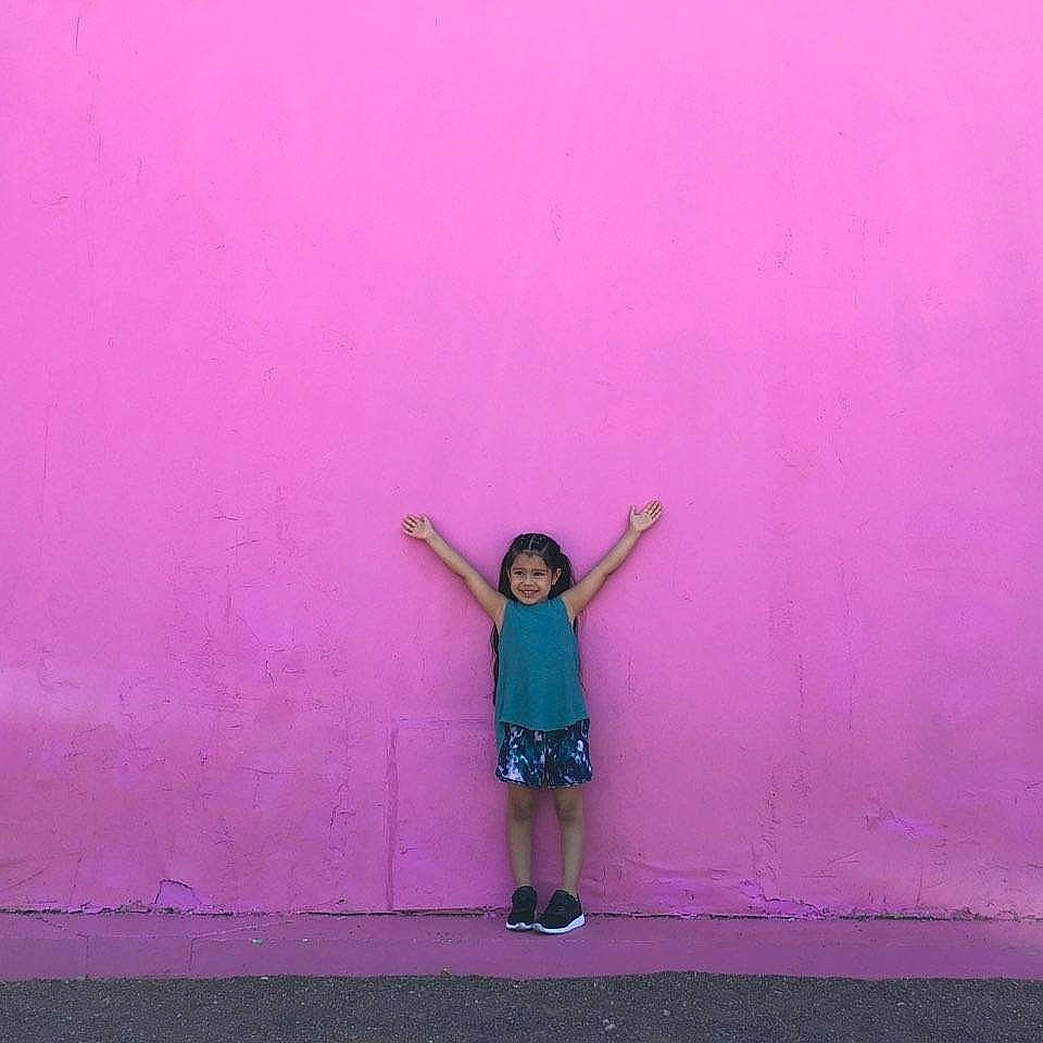 Esmeralda is registered to the contest to win money with this photo: blue, fun, happy, human_leg, joint, joy, magenta, person, photography, pink, purple, red, snapshot, standing, violet, wall
