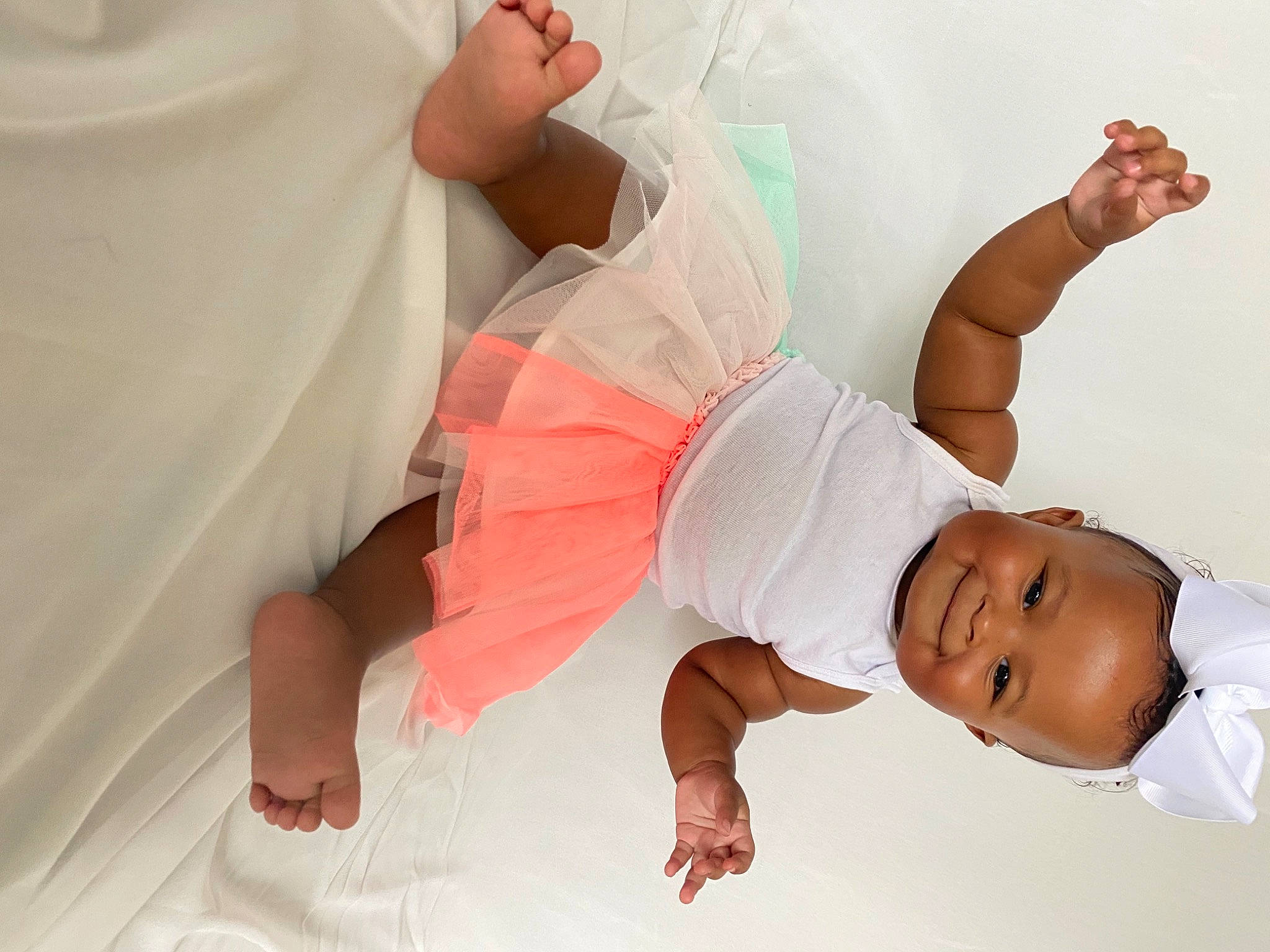 Bria is registered to the contest to win money with this photo: abdomen, arm, baby, child, comfort, elbow, finger, fun, gesture, happy, human_body, human_leg, joint, joy, knee, person, sleeve, smile, stomach, thigh
