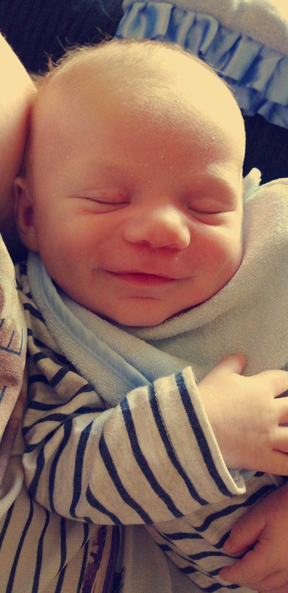 Braydon is registered to the contest to win money with this photo: arm, baby, cheek, child, chin, close_up, ear, eye, face, facial_expression, forehead, hand, head, lip, mouth, nose, person, skin, sleep, smile