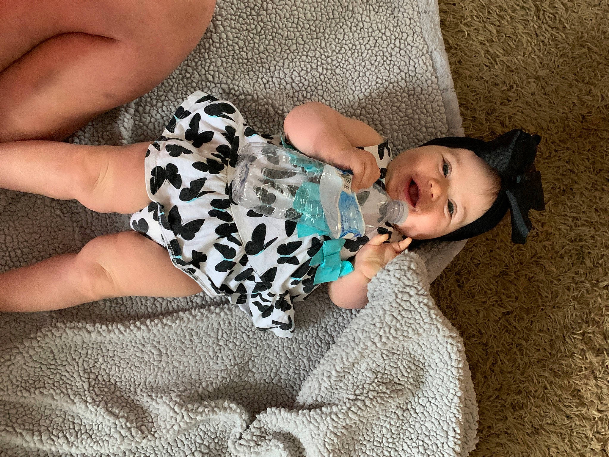 Delaney is registered to the contest to win money with this photo: baby, canidae, child, companion_dog, design, ear, finger, hand, leg, non_sporting_group, pattern, person, photography, play, product, puppy, sitting, toddler