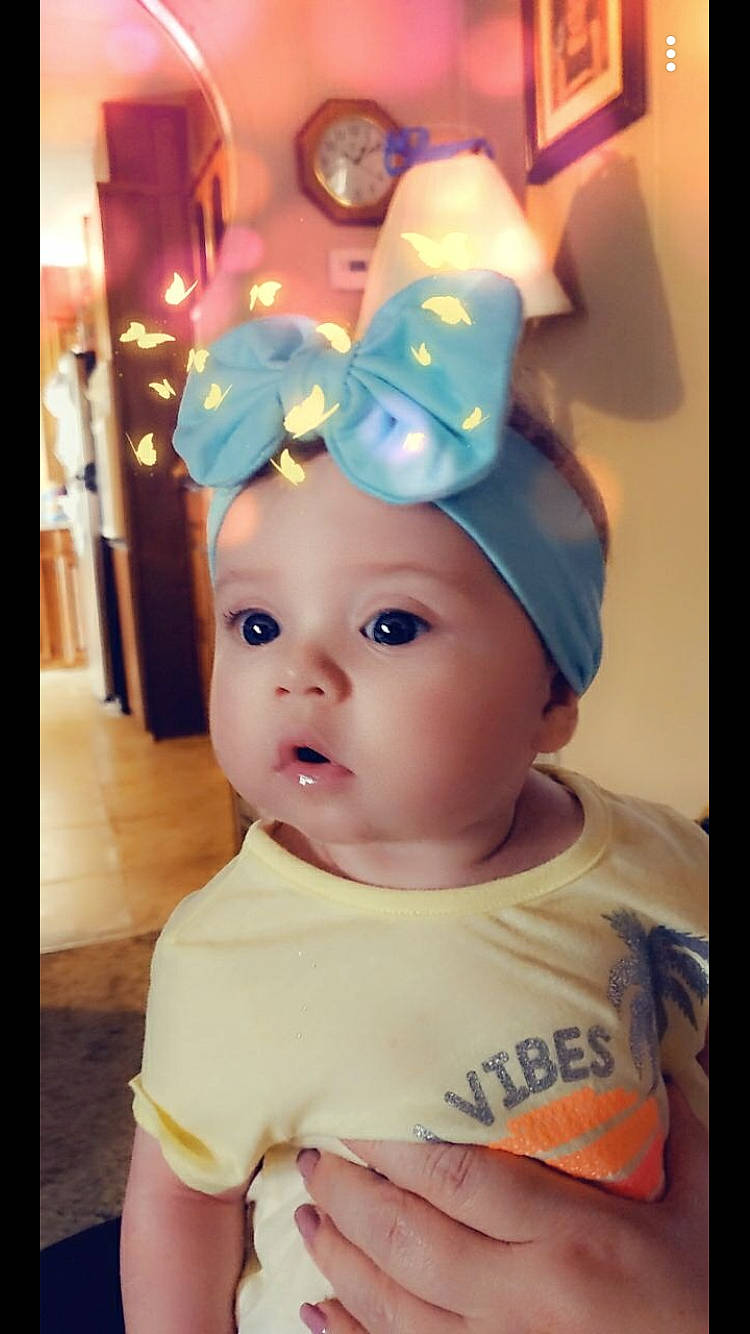 Delaney is registered to the contest to win money with this photo: baby, child, hair_accessory, headgear, headwear, person, toddler