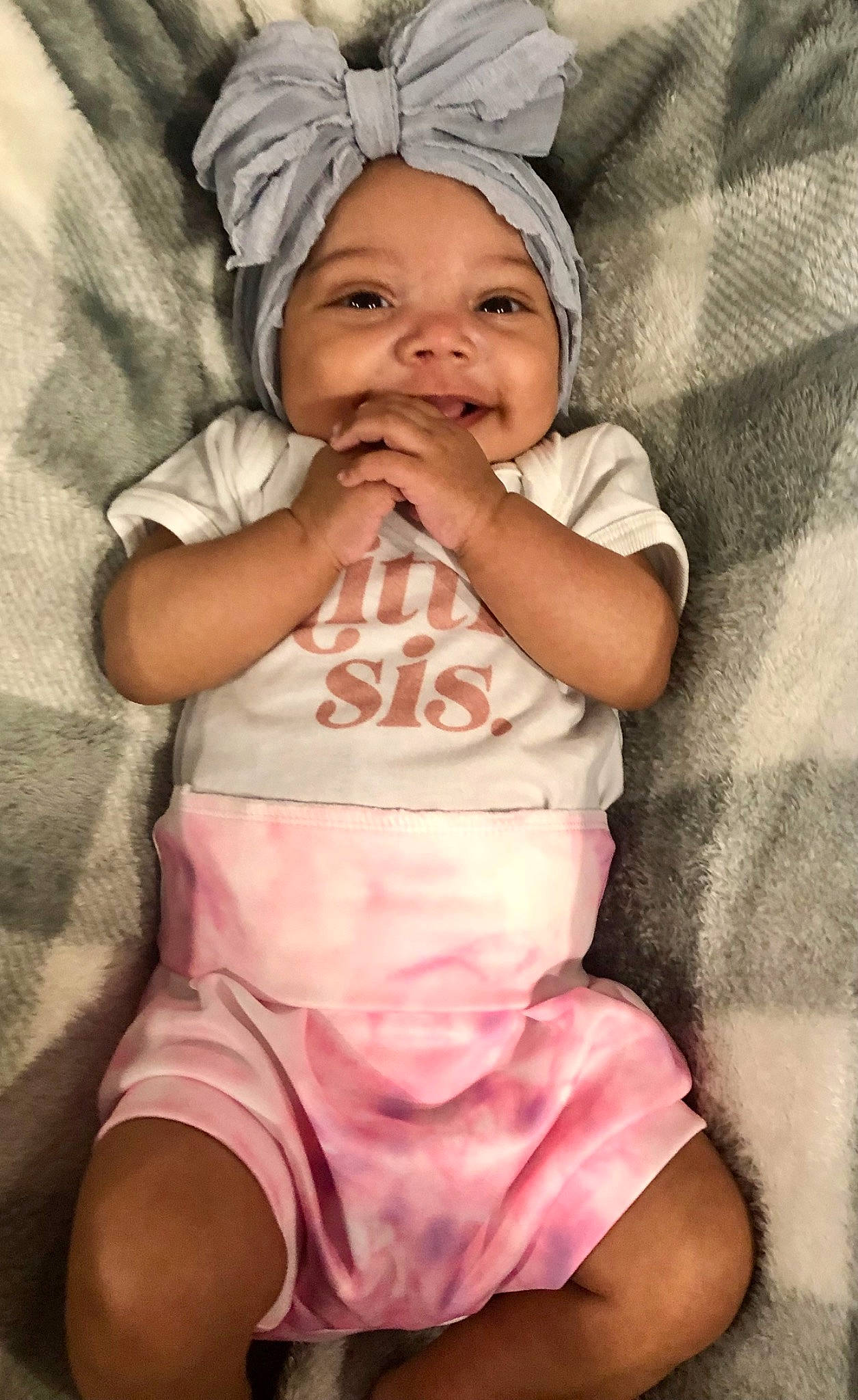 Bralyn is registered to the contest to win money with this photo: baby, baby_sleeping, baby_toddler_clothing, cheek, comfort, eye, face, finger, gesture, happy, headgear, headwear, mouth, nose, person, pink, skin, sleeve, smile, stomach