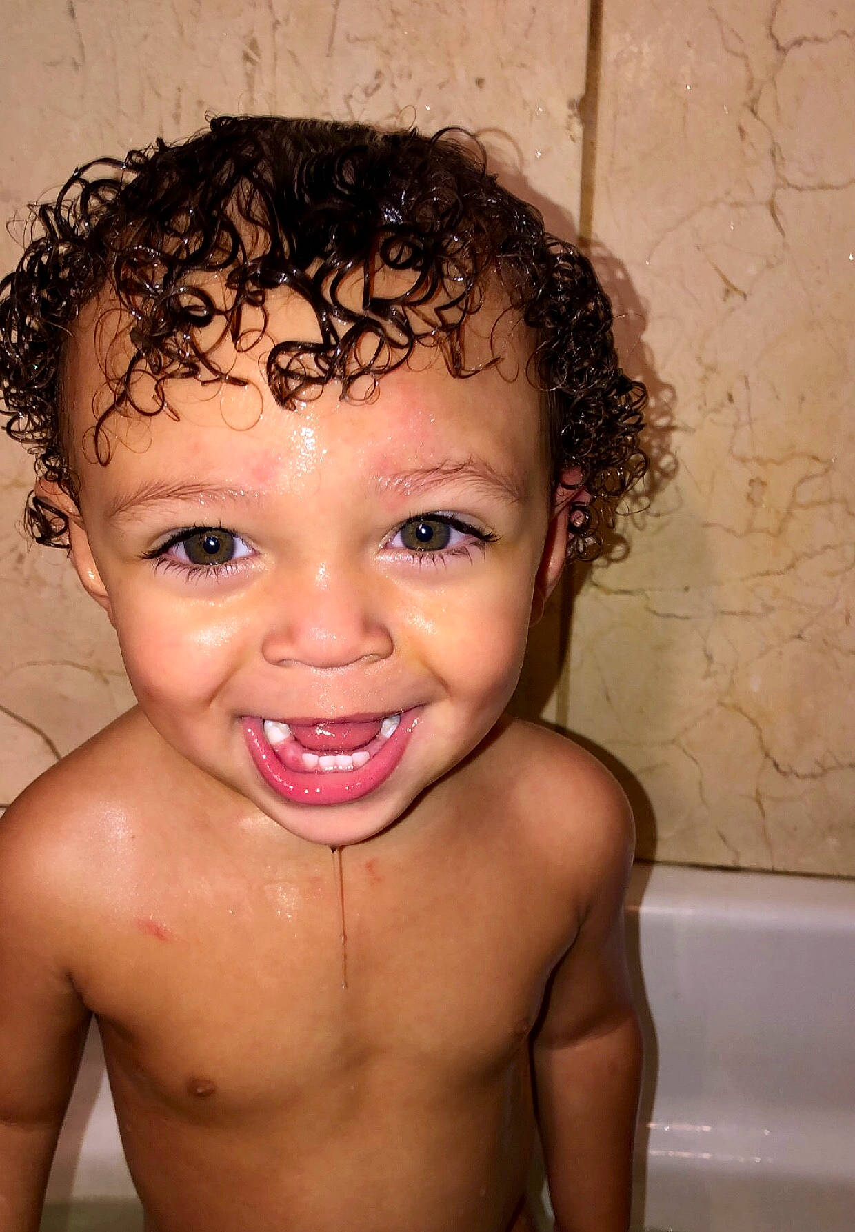 Kyrie is registered to the contest to win money with this photo: arm, bathtub, cheek, chin, eye, eyebrow, eyelash, flash_photography, forehead, hair, happy, human_body, iris, jaw, lip, mouth, neck, nose, person, skin