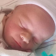 Theodore River joined the competition — help win amazing prizes! newborn, baby, sleeping, infant, hat, white_clothing, blanket, closeup, peaceful, soft_light, face, skin, portrait, resting, cozy, cute, child, newborn_baby, indoors, gentle