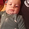 baby, cheeks, child, closeup, clothing, cozy, cuteness, expression, face, head, human, indoor, infant, onesie, person, portrait, relaxed, skin, sleepy, young