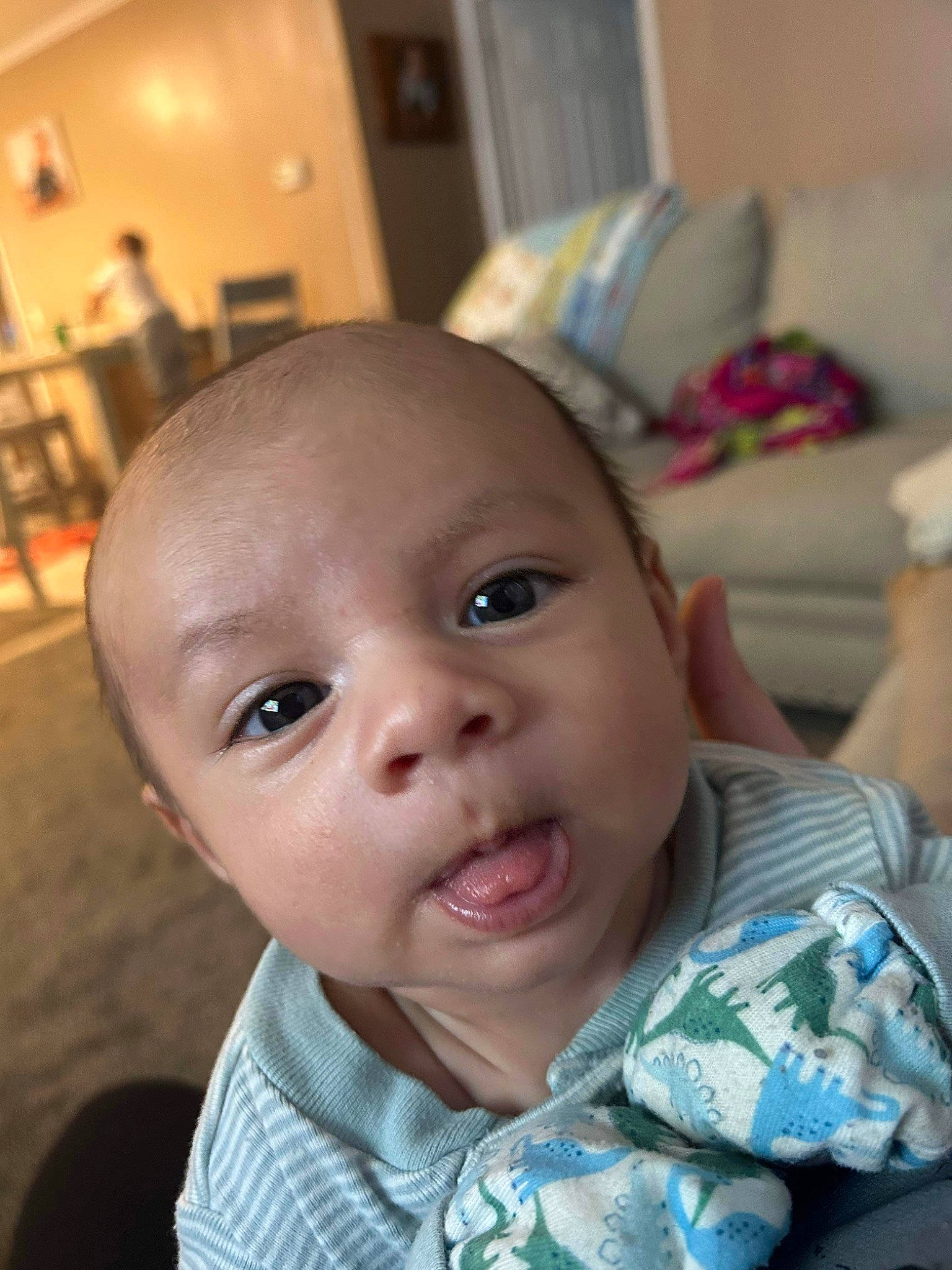 Chase is registered to the contest to win money with this photo: baby, baby_toddler_clothing, cheek, child, ear, eyebrow, eyelash, forehead, fun, happy, jaw, mouth, nose, person, room, sitting, skin, smile, surprised, toddler