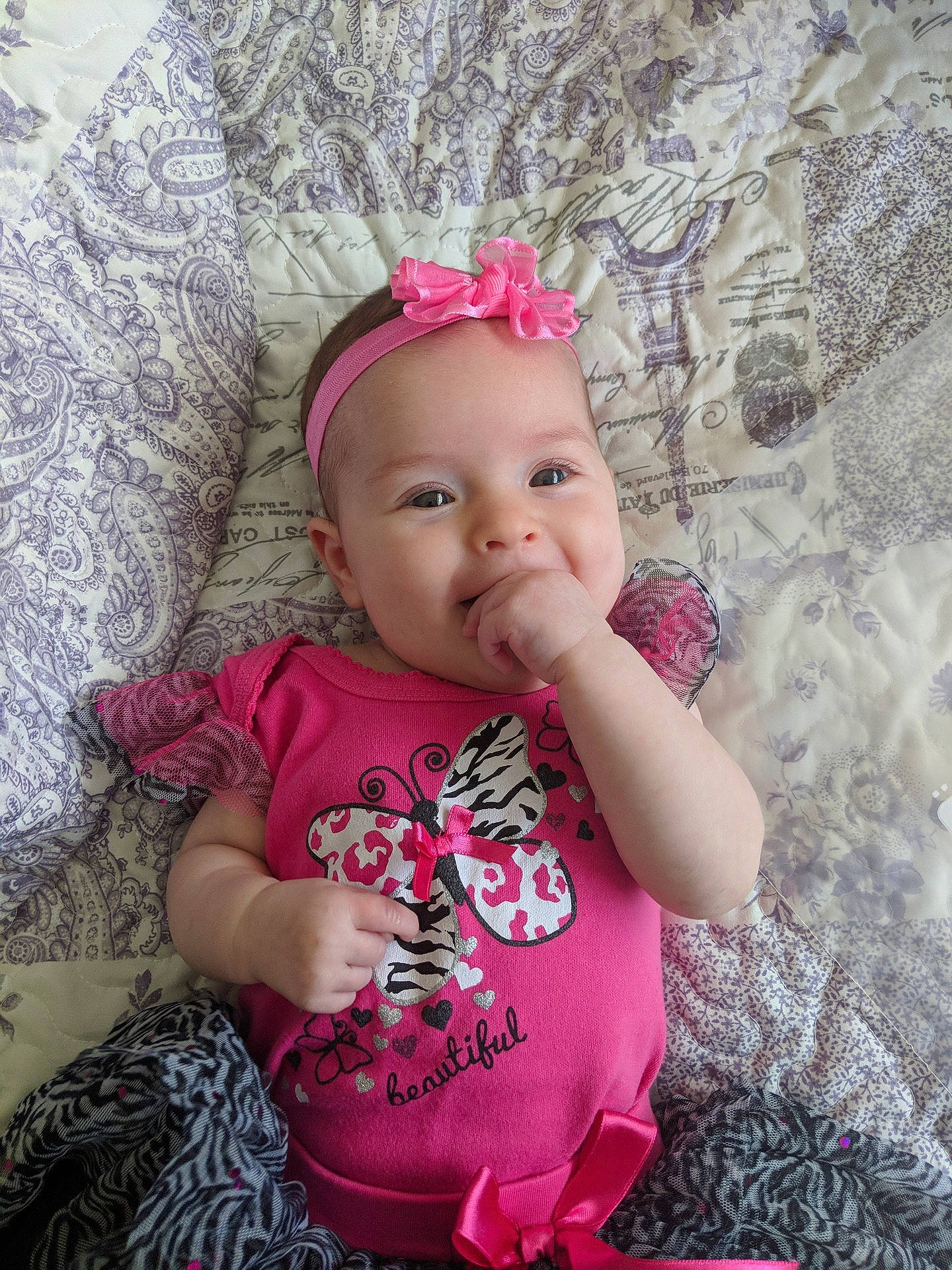 Alice is registered to the contest to win money with this photo: cheek, child, day, eye, girl, hair_accessory, headband, headgear, infant, magenta, person, pink, product, skin, smile, textile, toddler