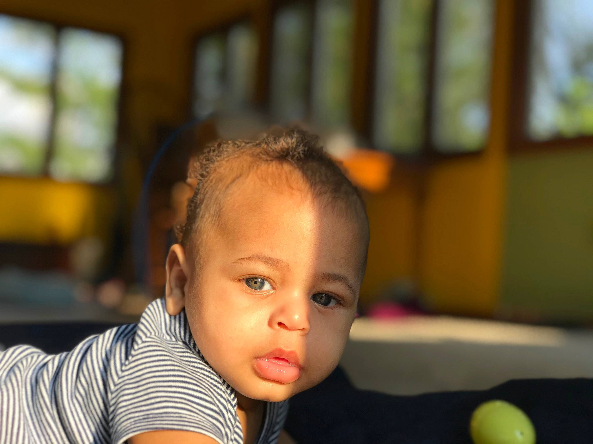 Brian is registered to the contest to win money with this photo: baby, cheek, child, chin, ear, eye, face, forehead, fun, head, nose, people, person, photography, room, sitting, skin, smile, toddler, vacation