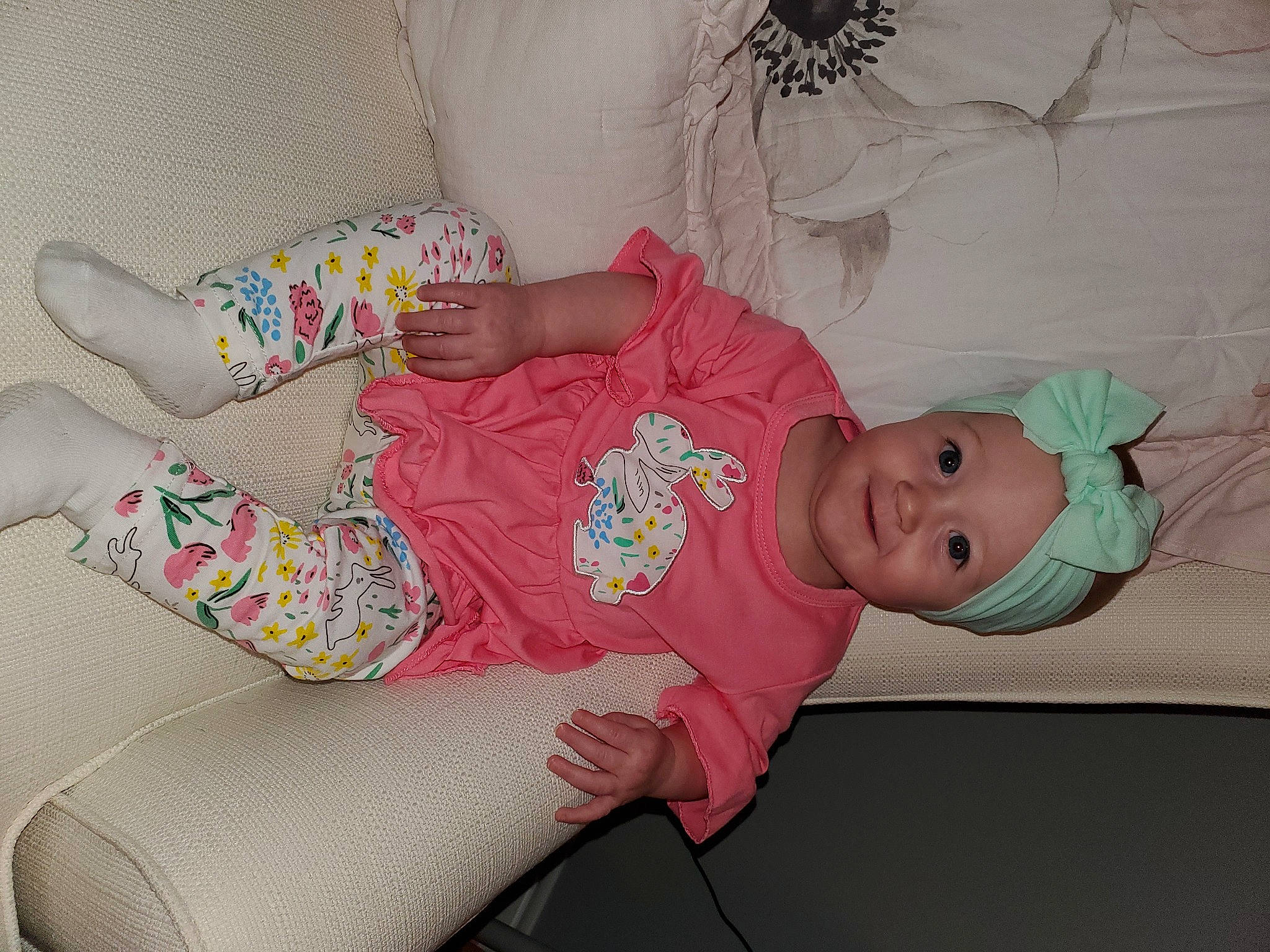 Harper joined the competition — help win amazing prizes! arm, baby, baby_products, baby_toddler_clothing, cheek, child, comfort, eye, face, headwear, joy, leg, linens, pattern, person, pink, product, skin, sleeve, smile