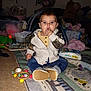 Addisyn joined the competition — help win amazing prizes! baby, child, toy, play_mat, jeans, jacket, stuffed_animal, diapers, indoor, carpet, floor, pampers, baby_wipes, sitting, cute, infant, chewing, clothing, person, home