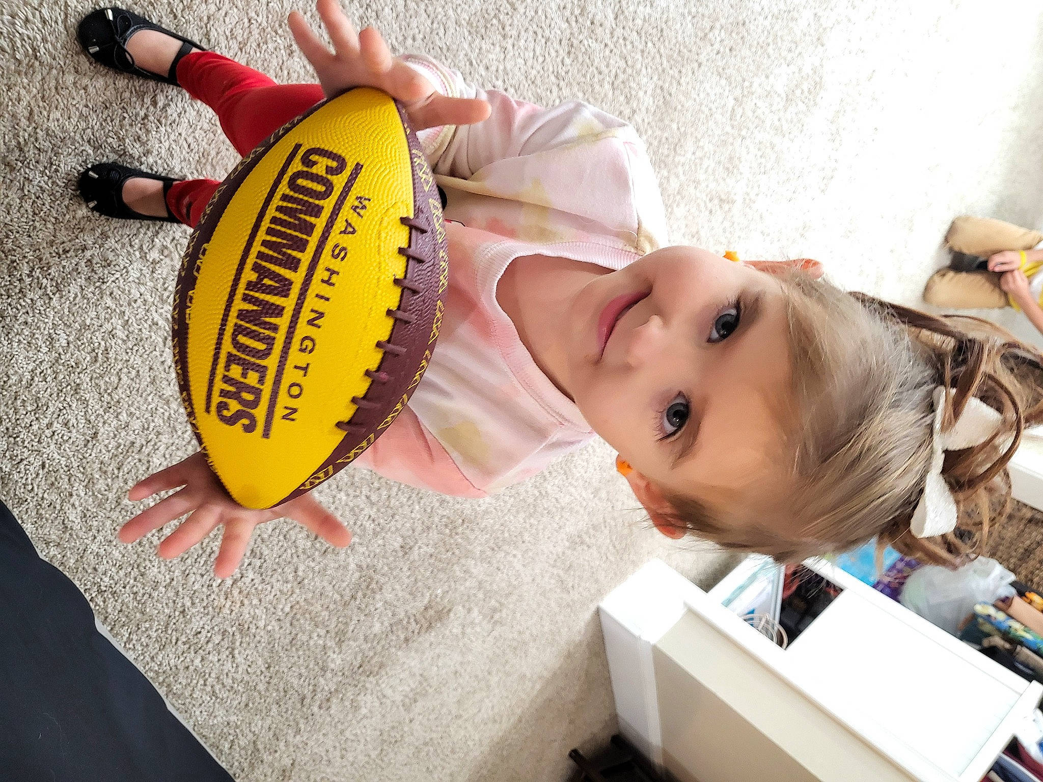 Rylee joined the competition — help win amazing prizes! baby, baby_toddler_clothing, ball, ball_game, child, eyelash, fashion_accessory, finger, football, glove, hand, happy, hat, joy, person, personal_protective_equipment, soccer_ball, sports_equipment, sports_gear, sports_toy