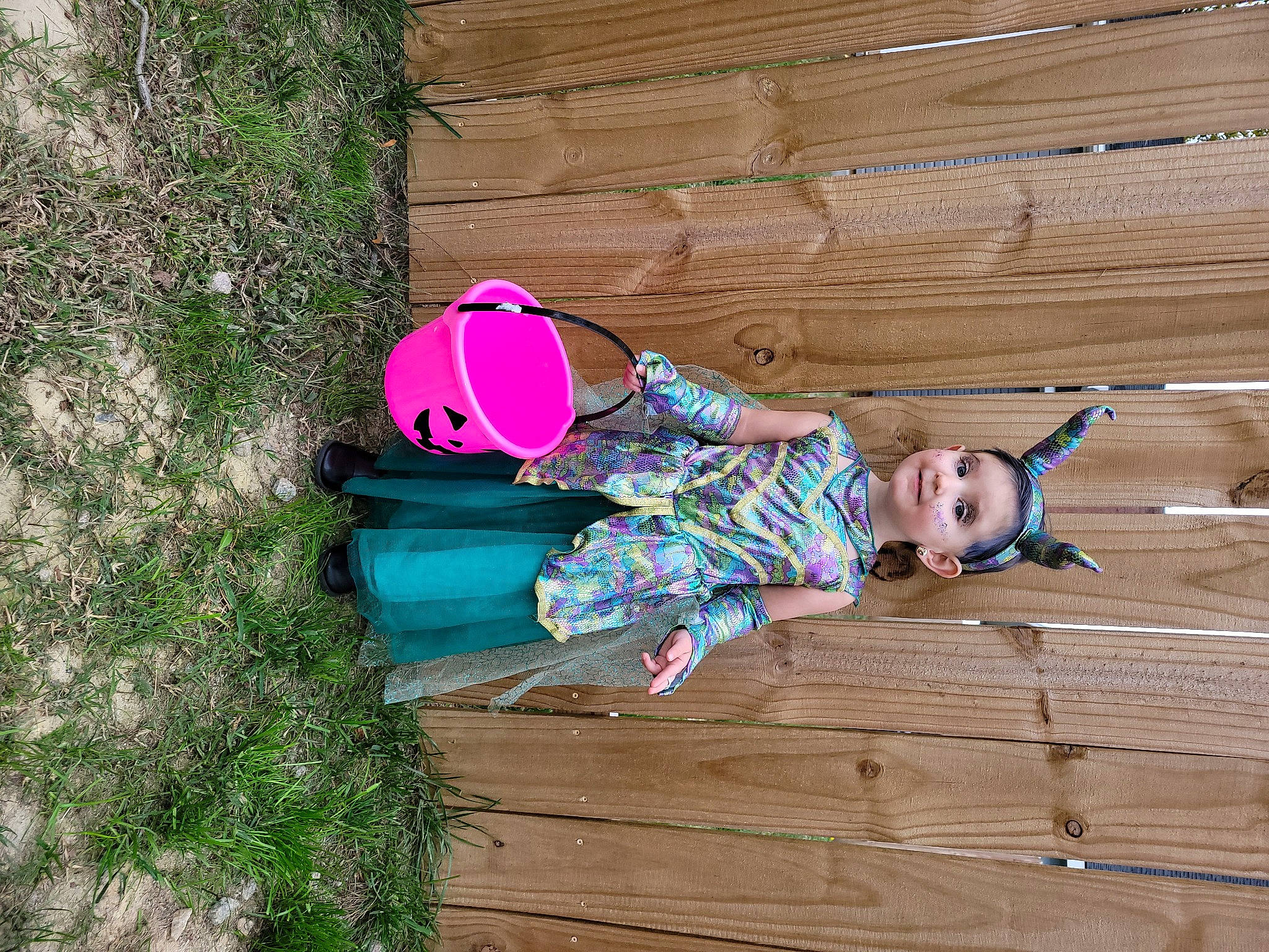 Rylee is registered to the contest to win money with this photo: baby_toddler_clothing, child, flooring, fun, grass, happy, hardwood, hat, joy, leisure, magenta, pattern, people_in_nature, person, pink, plant, sitting, sunglasses, toddler, tree