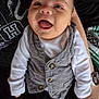 Elijah joined the competition — help win amazing prizes! baby, child, smiling, vest, white_shirt, sitting, person, face, happy, lap, watch, clothing, indoor, cute, infant, portrait, human, casual, closeup, expression