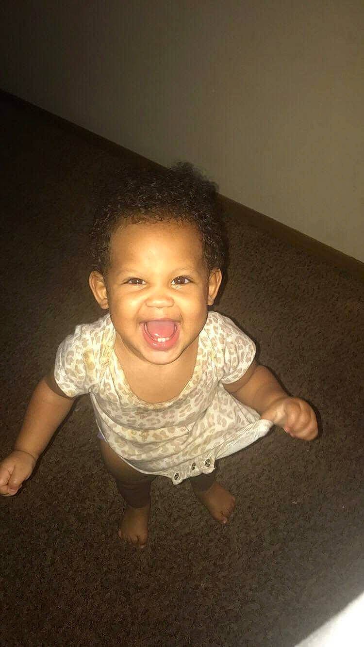 Lilly'Anna is registered to the contest to win money with this photo: arm, cheek, child, face, fun, happy, head, joy, nose, person, sitting, skin, smile, standing, toddler