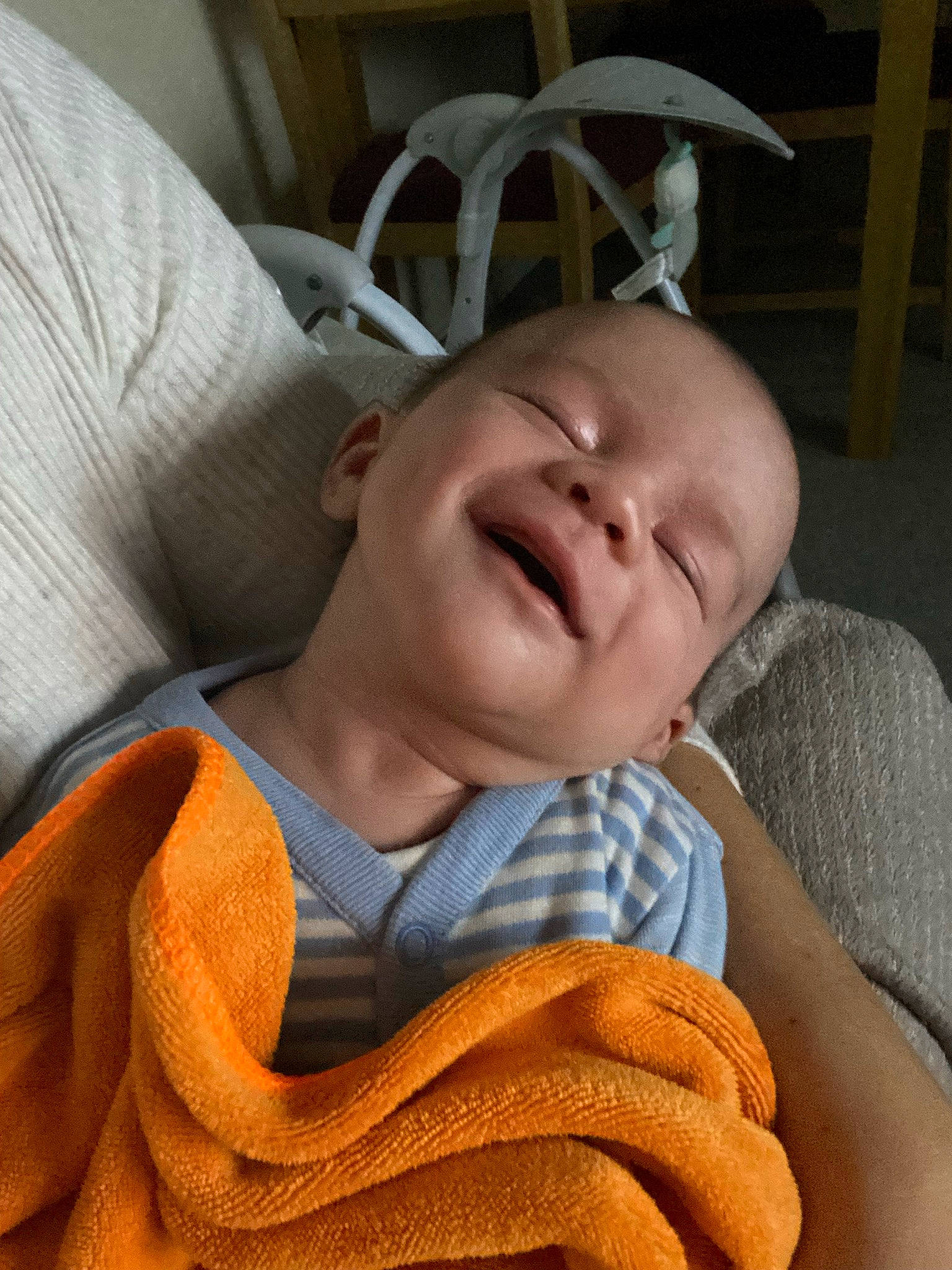 Tyler is registered to the contest to win money with this photo: baby, baby_products, baby_toddler_clothing, cheek, child, chin, comfort, facial_expression, happy, linens, mammal, nose, person, room, sitting, skin, smile, textile, thumb, toddler