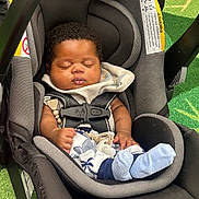Aakari joined the competition — help win amazing prizes! baby, car_seat, sleeping, infant, child, blue_socks, blanket, seat_belt, curly_hair, indoors, green_carpet, comfort, peaceful, young_child, toddler, resting, clothing, strap, sunlight, portrait