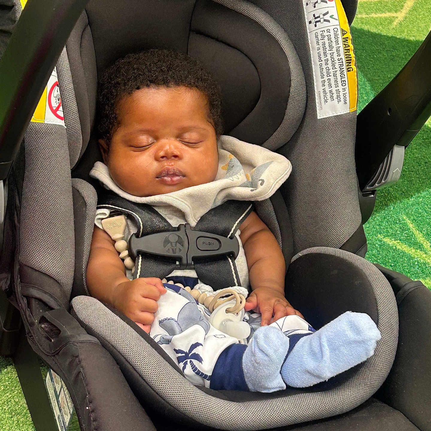 Aakari joined the competition — help win amazing prizes! baby, car_seat, sleeping, infant, child, blue_socks, blanket, seat_belt, curly_hair, indoors, green_carpet, comfort, peaceful, young_child, toddler, resting, clothing, strap, sunlight, portrait