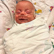 Ryet joined the competition — help win amazing prizes! baby, blanket, cute, duck_pattern, face, head, healthcare, hospital, infant, lying_down, medical, nasal_cannula, newborn, peaceful, person, sleeping, smile, soft_texture, swaddled, wrapped