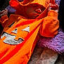 baby, sleeping, hoodie, orange, pumpkin, blanket, cozy, child, infant, cute, clothing, resting, soft, warm, indoor, portrait, closeup, festive, holiday, comfort