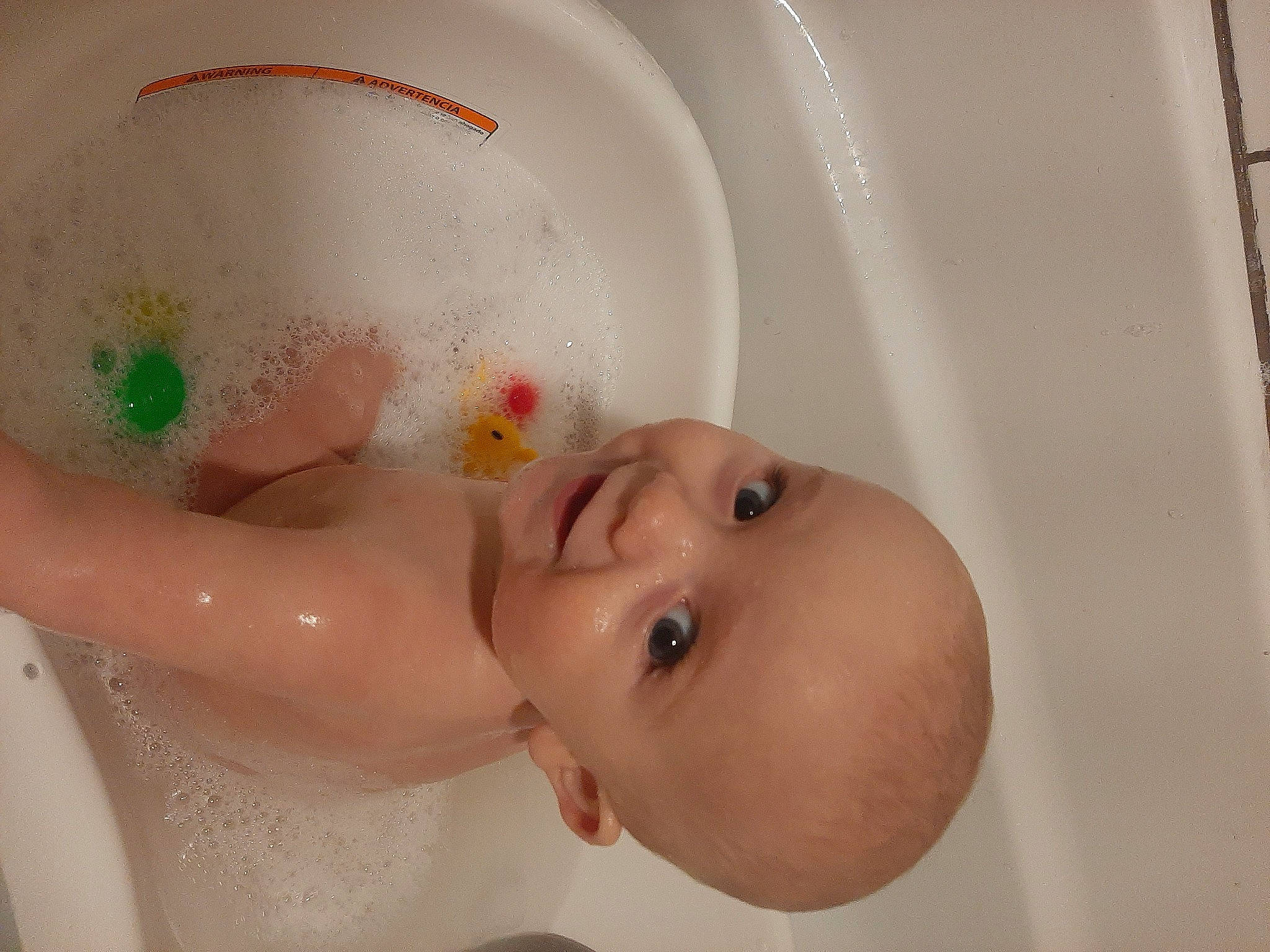 Westley is registered to the contest to win money with this photo: baby, baby_bathing, baby_products, bath_toy, bathing, bathroom, bathtub, cheek, chest, child, ear, eyelash, fluid, fun, person, plumbing, plumbing_fixture, skin, smile, toddler
