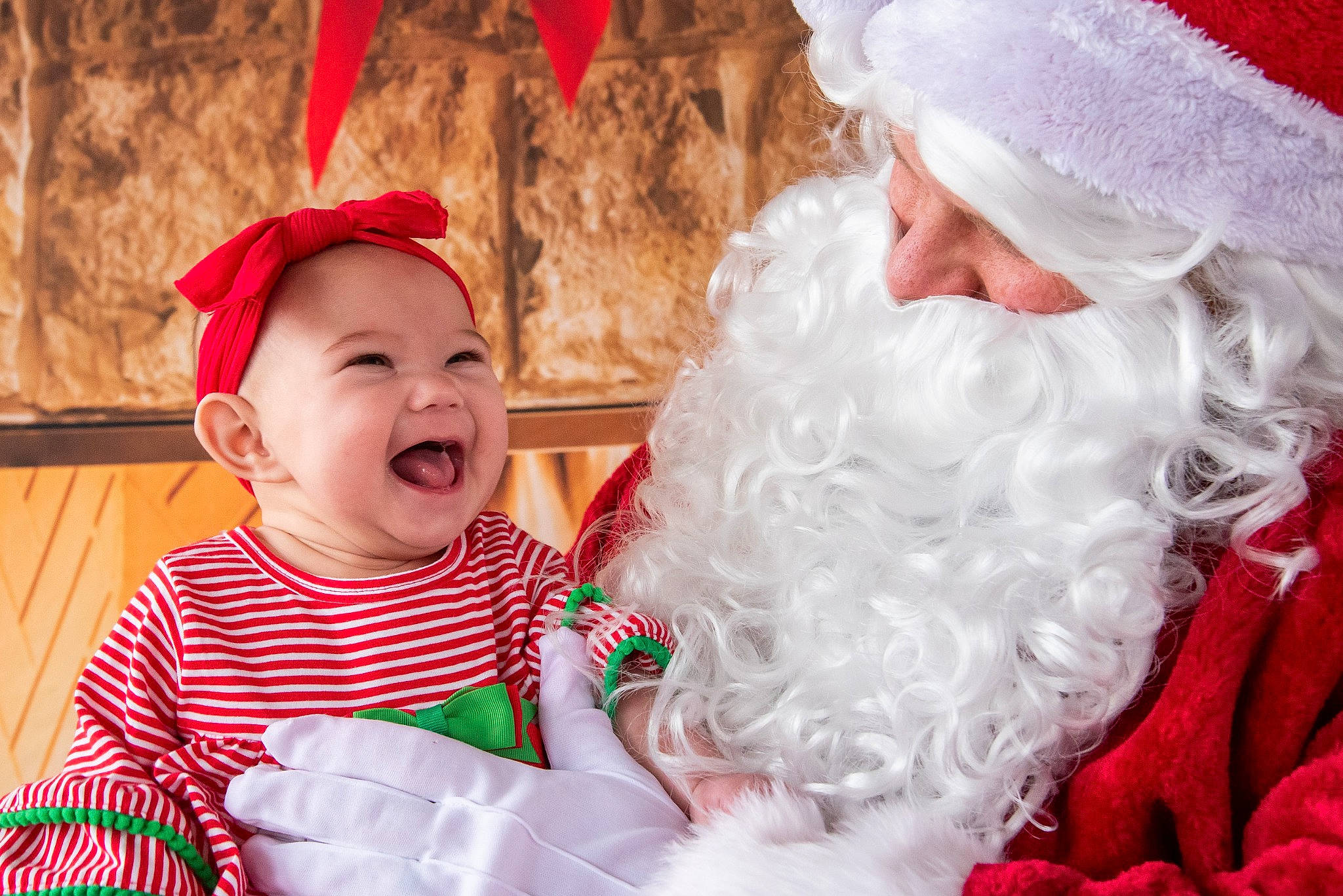 Charity joined the competition — help win amazing prizes! baby, baby_toddler_clothing, beard, christmas, christmas_eve, community, event, face, facial_expression, facial_hair, fun, happy, headgear, headwear, holiday, human_body, person, red, santa_claus, smile