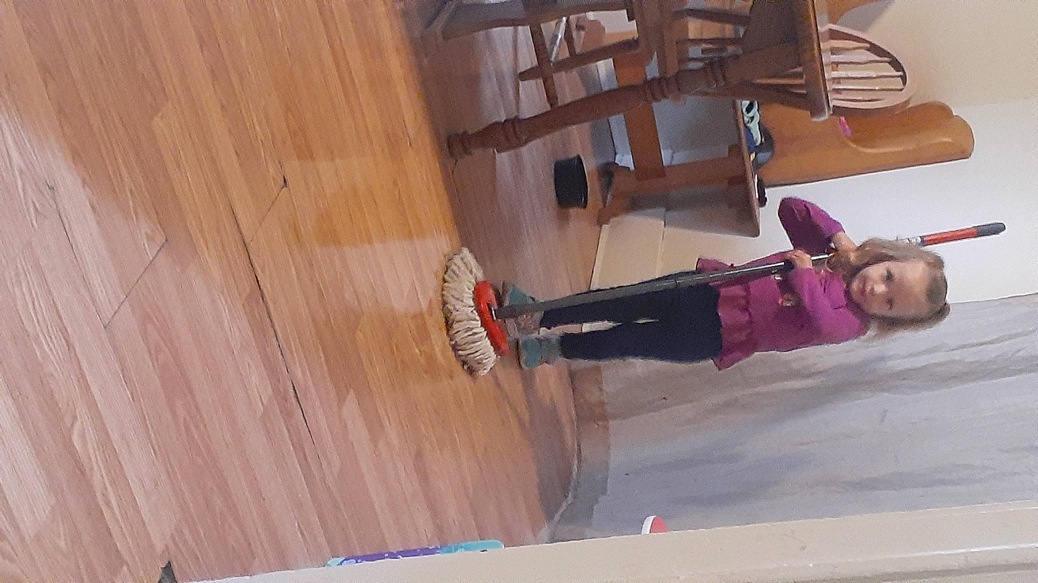 Paisley is registered to the contest to win money with this photo: boot, carmine, chair, cleanliness, composite_material, floor, flooring, hardwood, outdoor_shoe, pattern, person, plank, plywood, recreation, room, thigh, varnish, walking_shoe, wood, wood_flooring