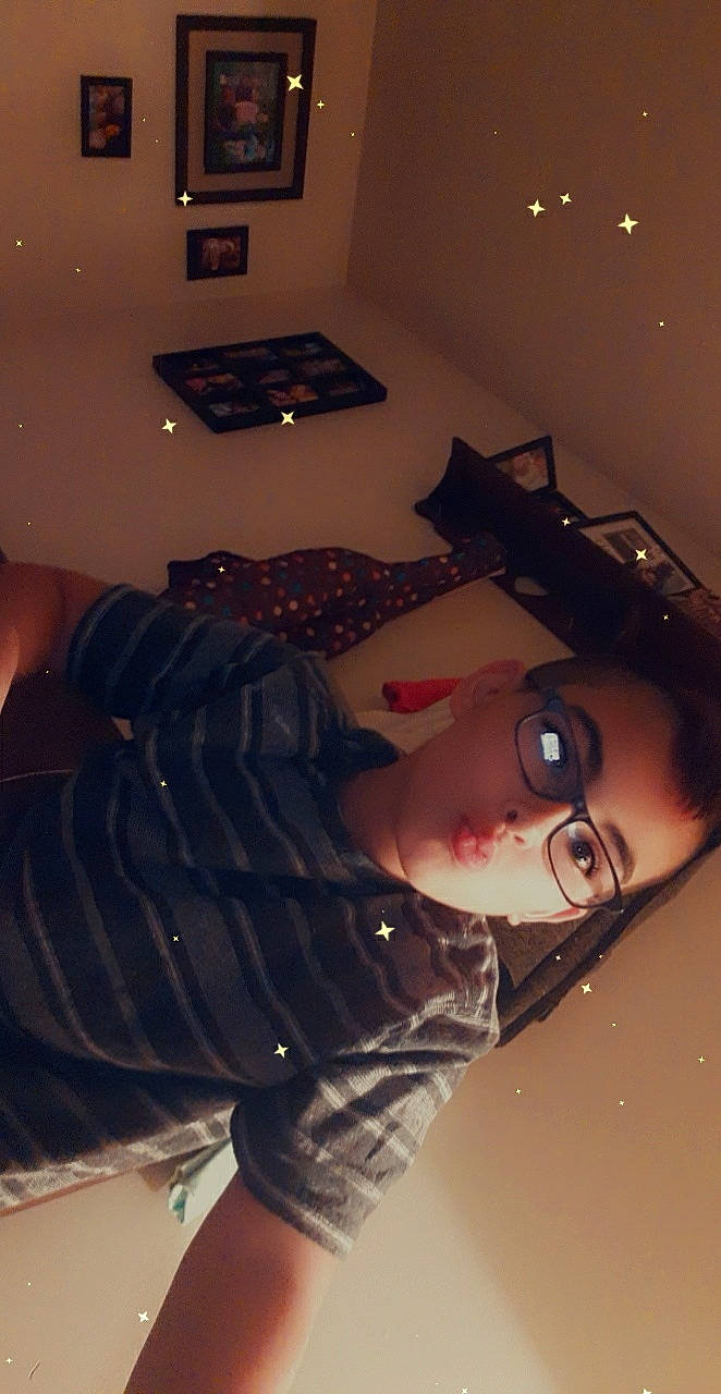 Isaiah joined the competition — help win amazing prizes! comfort, cool, design, eyewear, fashion_design, flash_photography, flooring, fun, fur, human_leg, lamp, lighting, living_room, person, room, sitting, thigh, tints_and_shades, vision_care